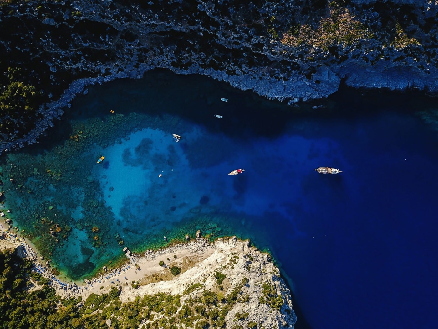 Turquoise Blue Lagoon at Krknjaši with anchored boats, Dalmatia, Croatia