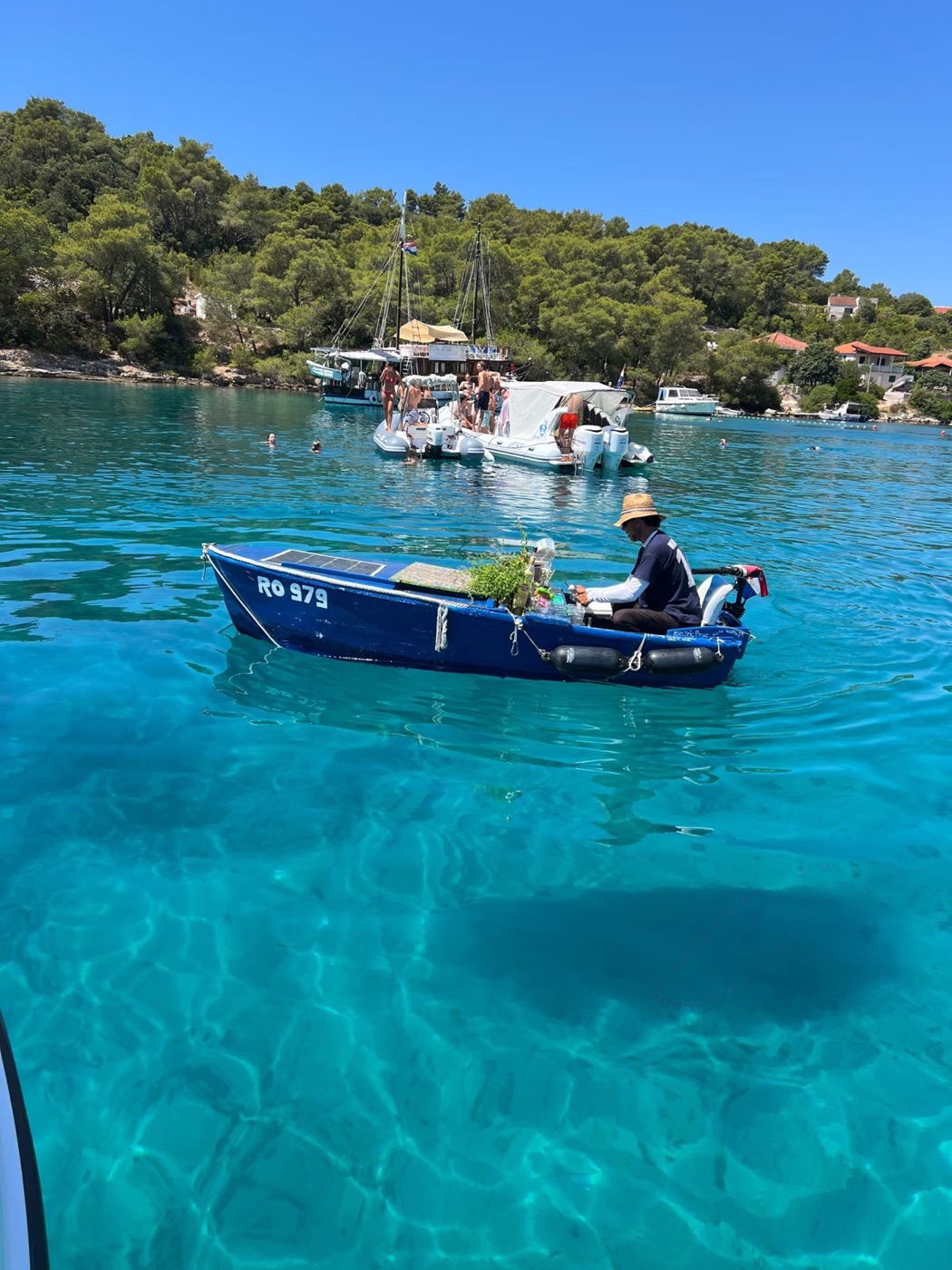 Traditional boat on crystal Adriatic water near Vis, Croatia