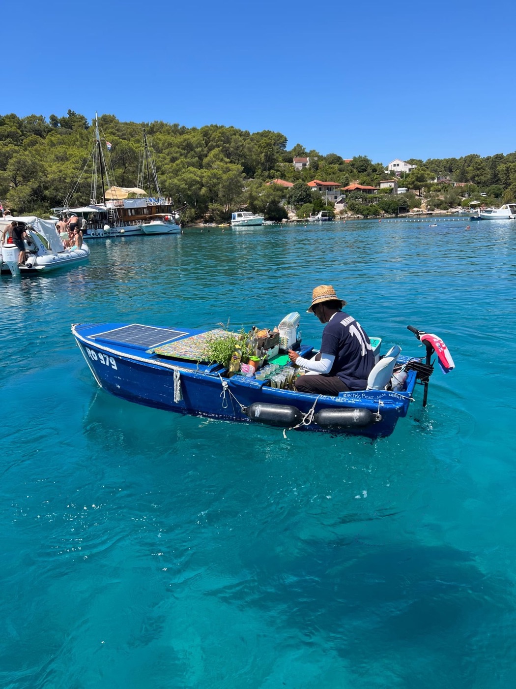Local electric boat bar in a turquoise Adriatic lagoon
