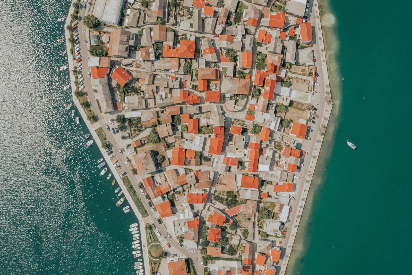 Aerial view of a Dalmatian coastal town and Adriatic harbor, northern Dalmatia, Croatia